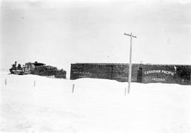 Steam engine, coal car and box car including Canadian Pacific rail car in snow near Melita, Manitoba