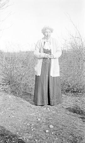 Emily Estlin knitting on Aitkens farm in Gordon Head