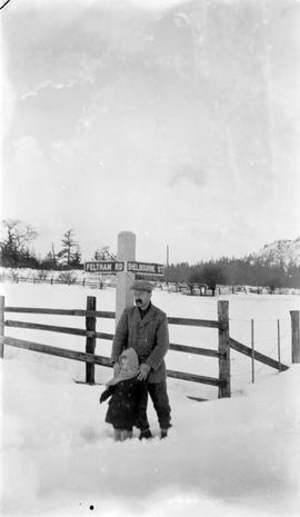 John Ballantine and son David in snow at north west corner of Shelbourne and Feltham