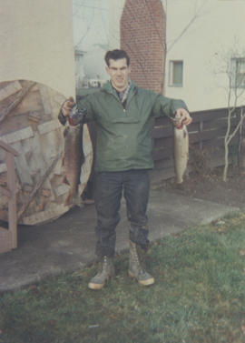 Jack Coey holding six pound and four-and-a-half pound cutthroat trout taken from the Colquitz River, March 1964