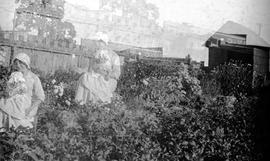 Woman and child in garden,