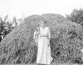 Emily Maude Estlin and Pickles the dog on Aitkens farm in Gordon Head