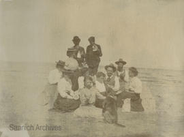 Bradshaw family eating watermelon at Cordova Bay