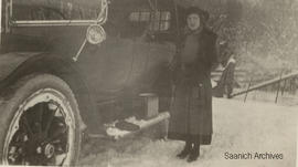 Dorothy Poulton, aged 17, beside a Cadillac automobile, 1917