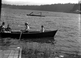 Women and children in rowboat