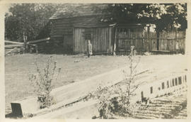 Child in front of building