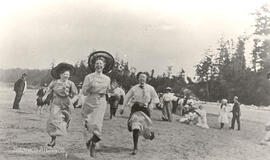 Young women racing on Cordova Bay Beach near McMorran's, 1912