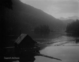 Log boom and floating building, possibly Knight Inlet, photograph by Annie Girling