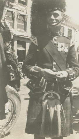 Member of Scottish Regiment band in parade