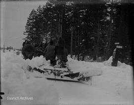 Horse-drawn snow plow clearing Ralph Street