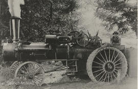 Henry Todd and a Case threshing machine