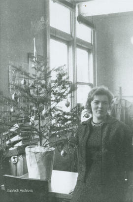 Helen Jackson beside Christmas tree