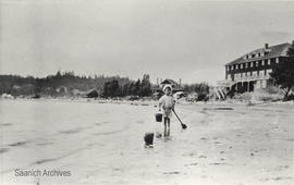 Ted Whitehead at Cadboro Bay, Cadboro Beach Hotel in background