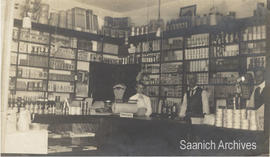 Interior of Wm. J. Chave & Son grocery store with Mary Chave, William Chave and Reginald Chave at the counter