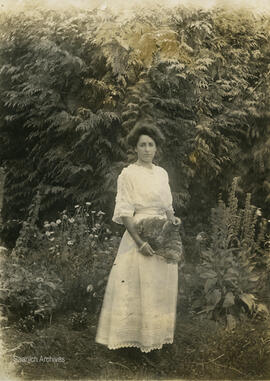 Muriel Nicholson holding a fan, Royal Oak