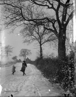 Girls playing in snow, photograph by Annie Girling