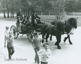 Councillors in period costume riding in carriage to meeting at Craigflower School